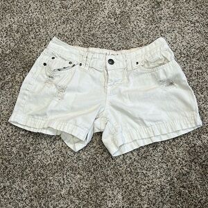 Maurices Women’s White Shorts Size 7/8 distressed. Small stain on the front.
